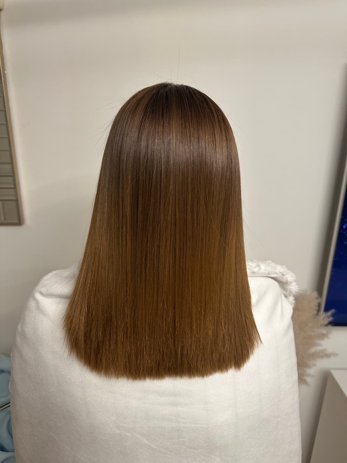 Cheveux lisses et brillants après lissage